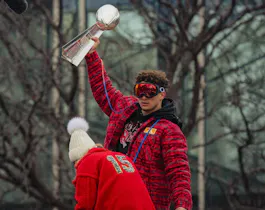 Patrick Mahomes of the Kansas City Chiefs hoists the Vince Lombardi Trophy. Our Super Bowl 57 predictions look at whether he'll claim another.