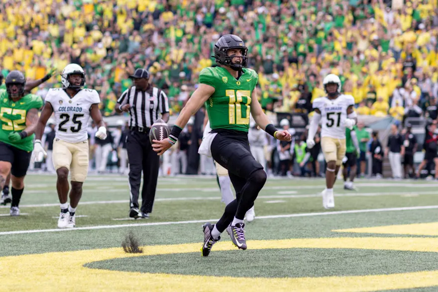 Quarterback Bo Nix #10 of the Oregon Ducks runs for a touchdown as we look at our best college football upset picks for Week 7