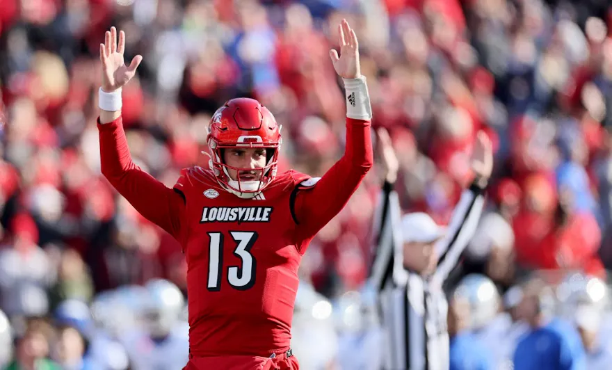 Jack Plummer #13 of the Louisville Cardinals celebrates a touchdown as we give our college football upset picks for conference championship week.