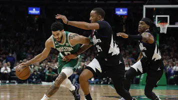 Jayson Tatum #0 of the Boston Celtics drives to the basket on Norman Powell #24 of the LA Clippers as we take a look at the latest NBA Finals odds heading into the All-Star break.