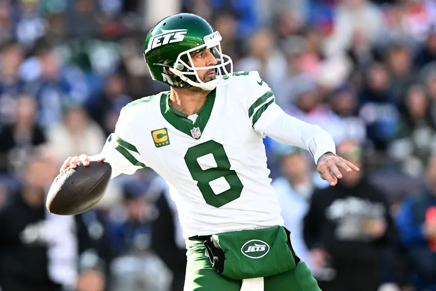New York Jets quarterback Aaron Rodgers looks to pass against the New England Patriots as we offer our Texans vs. Jets TNF prediction.
