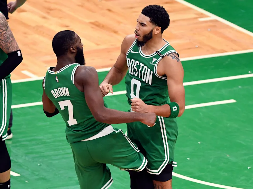 Jayson Tatum and Jaylen Brown of the Boston Celtics celebrate after scoring against the Milwaukee Bucks, and we offer new U.S. bettors our exclusive BetRivers bonus code.