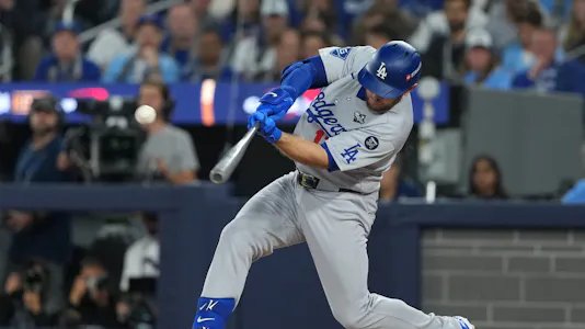 Los Angeles Dodgers third baseman Max Muncy (13) hits a single as we look at our Dodgers vs. Blue Jays Same Game Parlay for Game 2