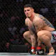 Tom Aspinall (red gloves) prior to the fight against Marcin Tybura (blue gloves) as we look at our best UFC 321 predictions