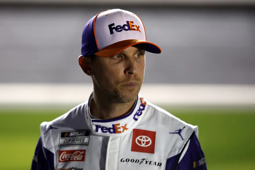 Denny Hamlin, driver of the #11 FedEx Express Toyota, stands on the grid during qualifying for the NASCAR Cup Series 64th Annual Daytona 500 at Daytona International Speedway on February 16, 2022 in Daytona Beach, Florida.