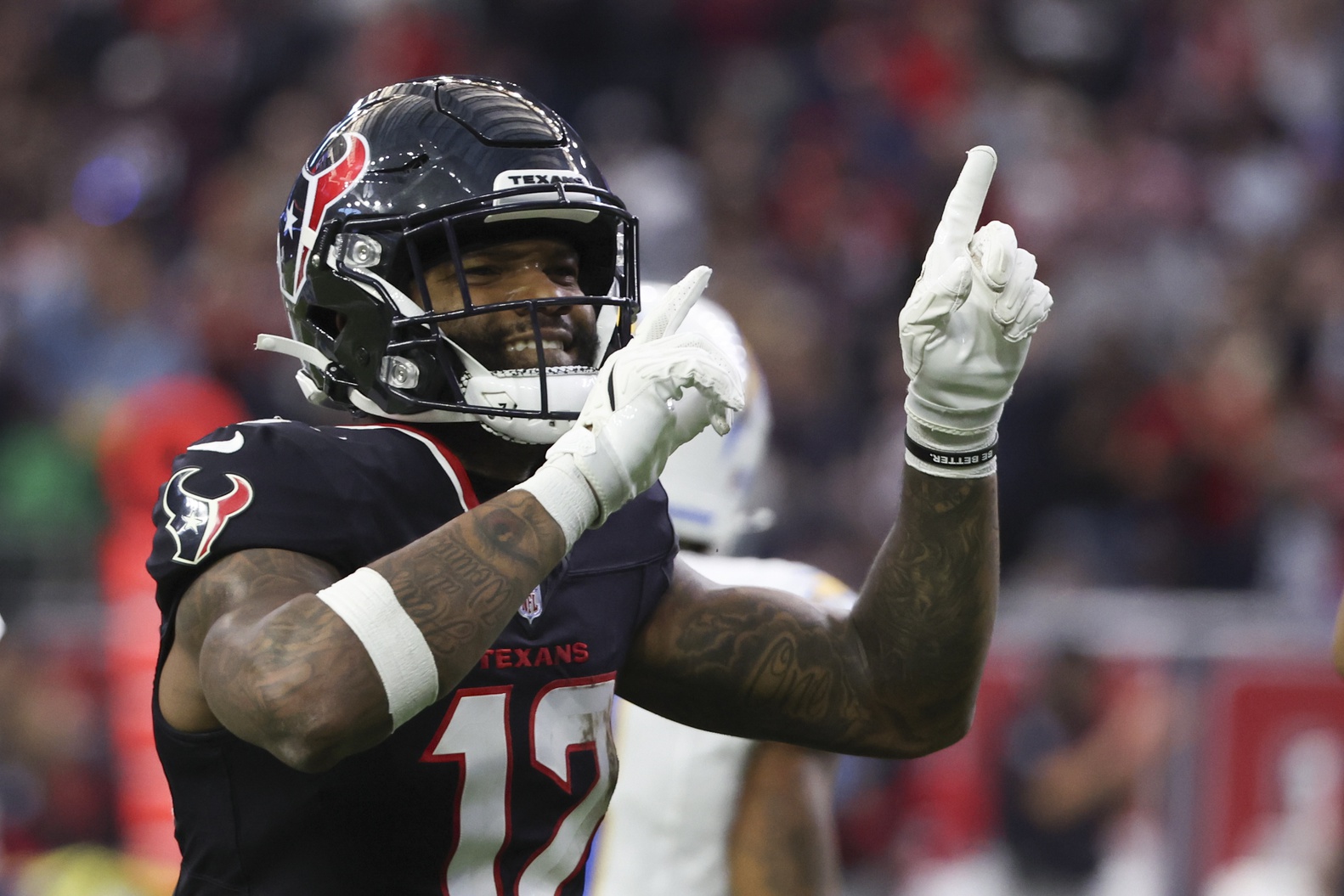 Houston Texans wide receiver Nico Collins reacts to a first down, and he's featured in our Raiders vs. Texans player props.