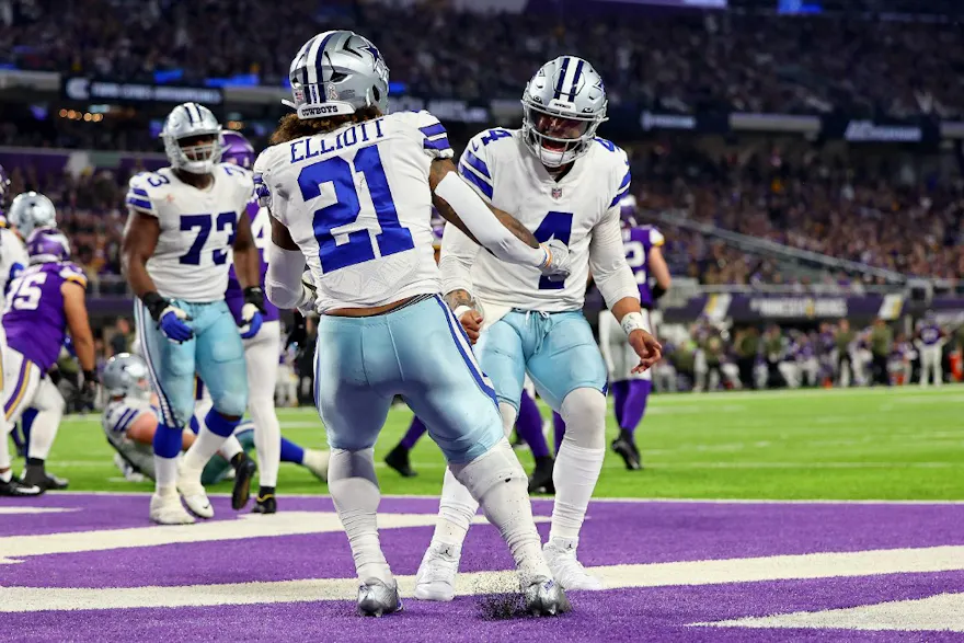Ezekiel Elliott of the Dallas Cowboys celebrates with teammate Dak Prescott after rushing for a touchdown against the Minnesota Vikings during the third quarter at U.S. Bank Stadium. Adam Bettcher/Getty Images/AFP.
