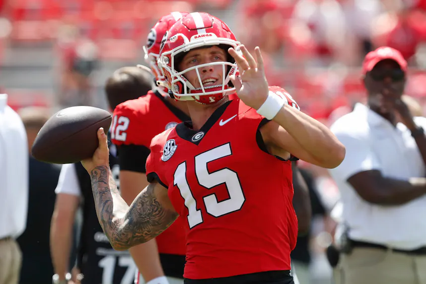 Carson Beck warms up before the start of an NCAA college football game as we look at our SEC predictions.