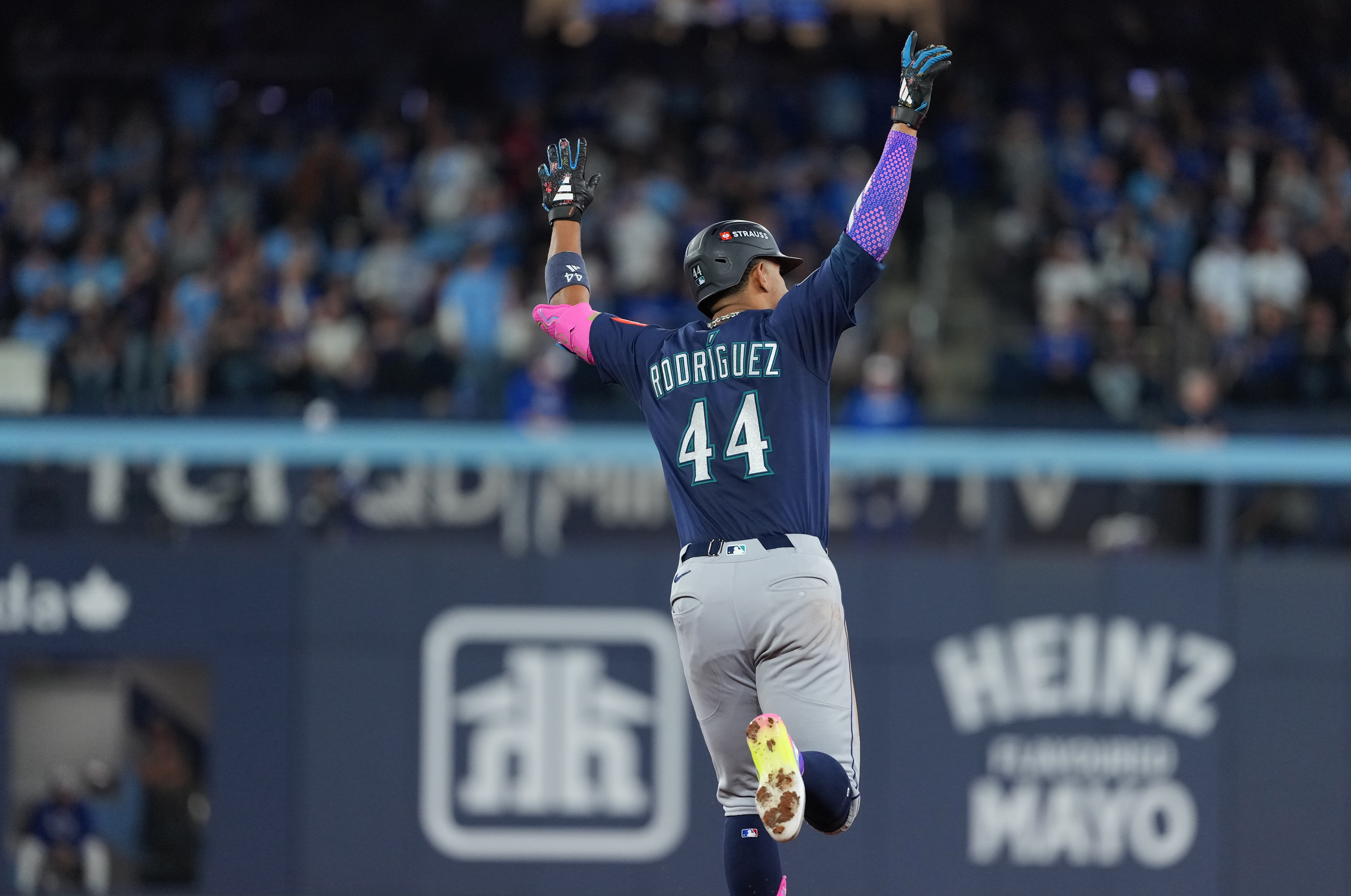 Seattle Mariners center fielder Julio Rodriguez celebrates after hitting a home run as we offer our MLB best bets and predictions for Opening Day. 