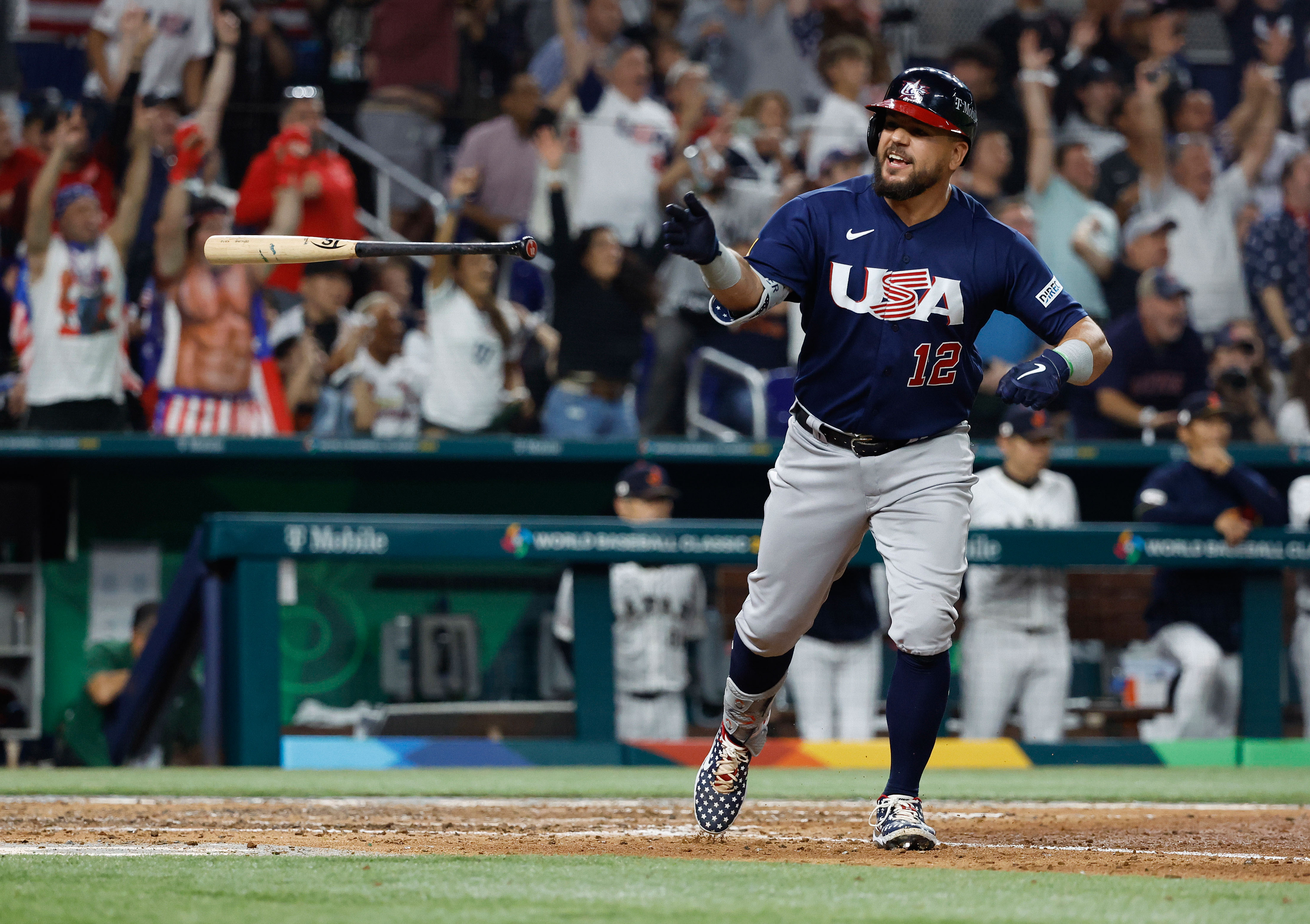 USA designated hitter Kyle Schwarber (12) reacts after hitting a home run against Japan in the World Baseball Classic.