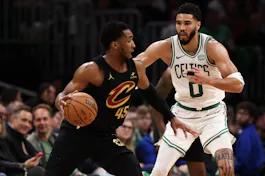 Jayson Tatum (0) of the Boston Celtics defends Donovan Mitchell (45) of the Cleveland Cavaliers, as we offer our best Celtics vs. Cavaliers player props for Game 3 on Saturday at Rocket Mortgage FieldHouse in Cleveland.