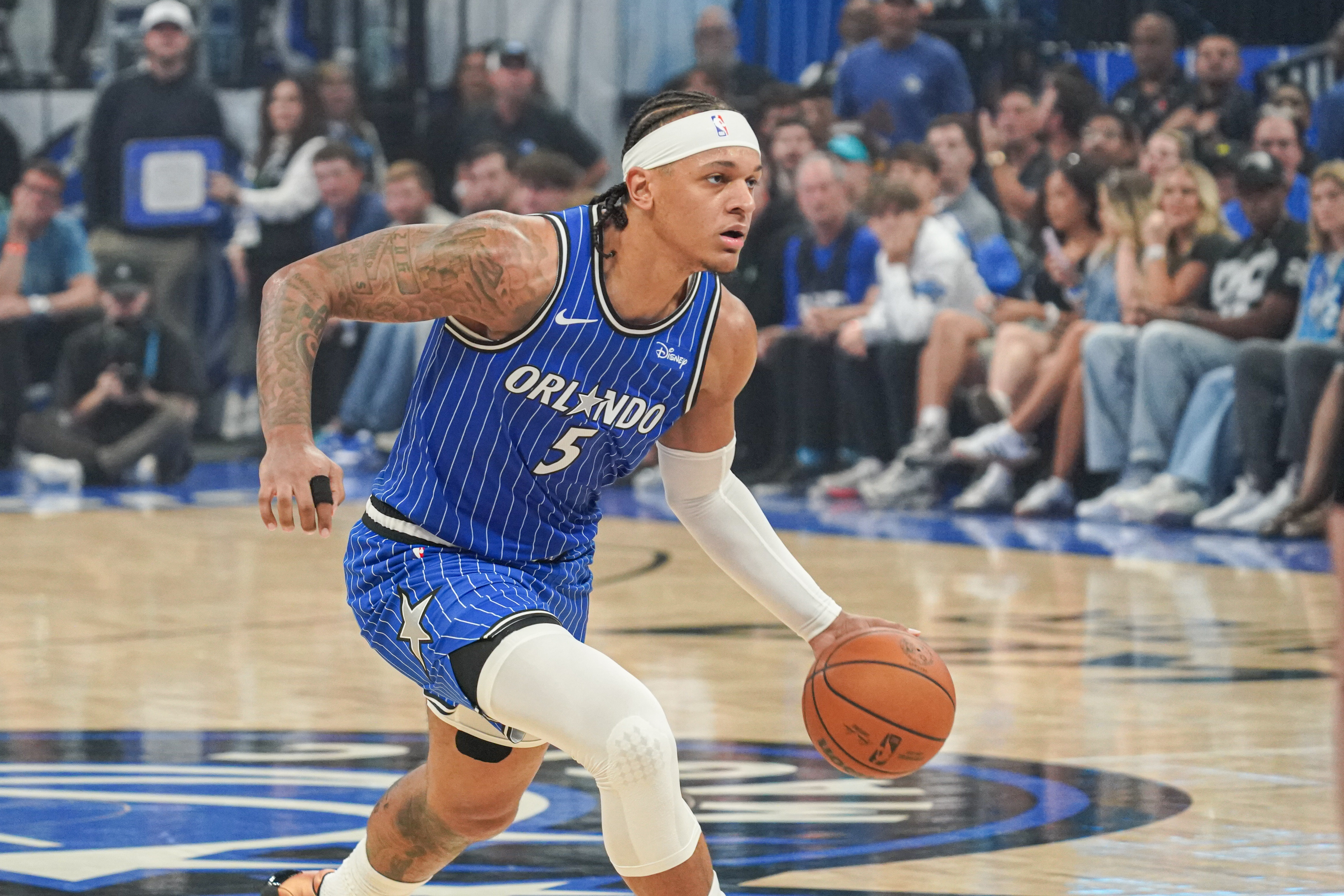 Orlando Magic forward Paolo Banchero (5), seen here running up the court, is featured in our Magic vs. Pistons player props for Game 2 today.