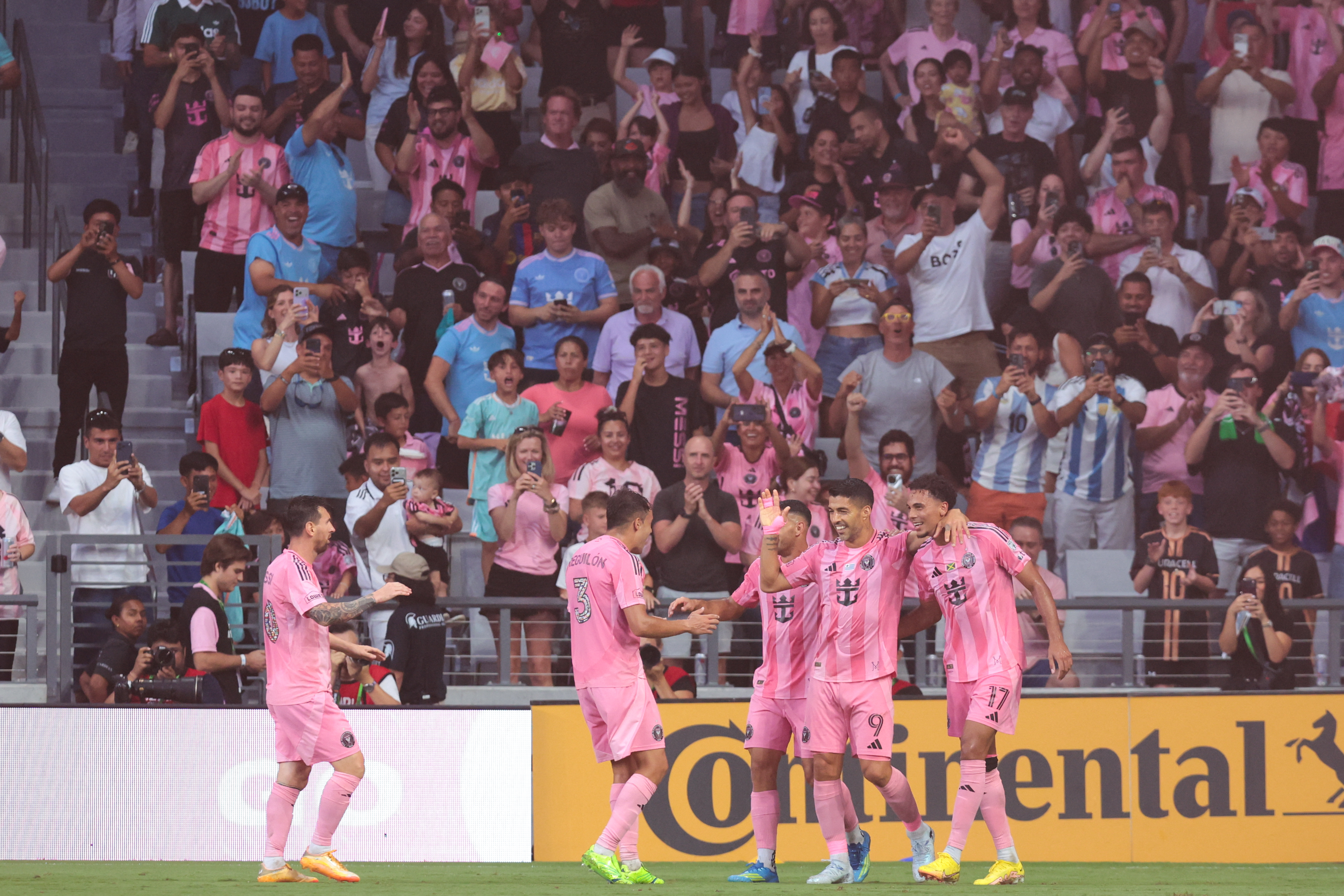 Inter Miami CF forward Luis Suarez (9) celebrates with teammates after scoring as he is featured on our Inter Miami vs. Chicago Fire prediction.