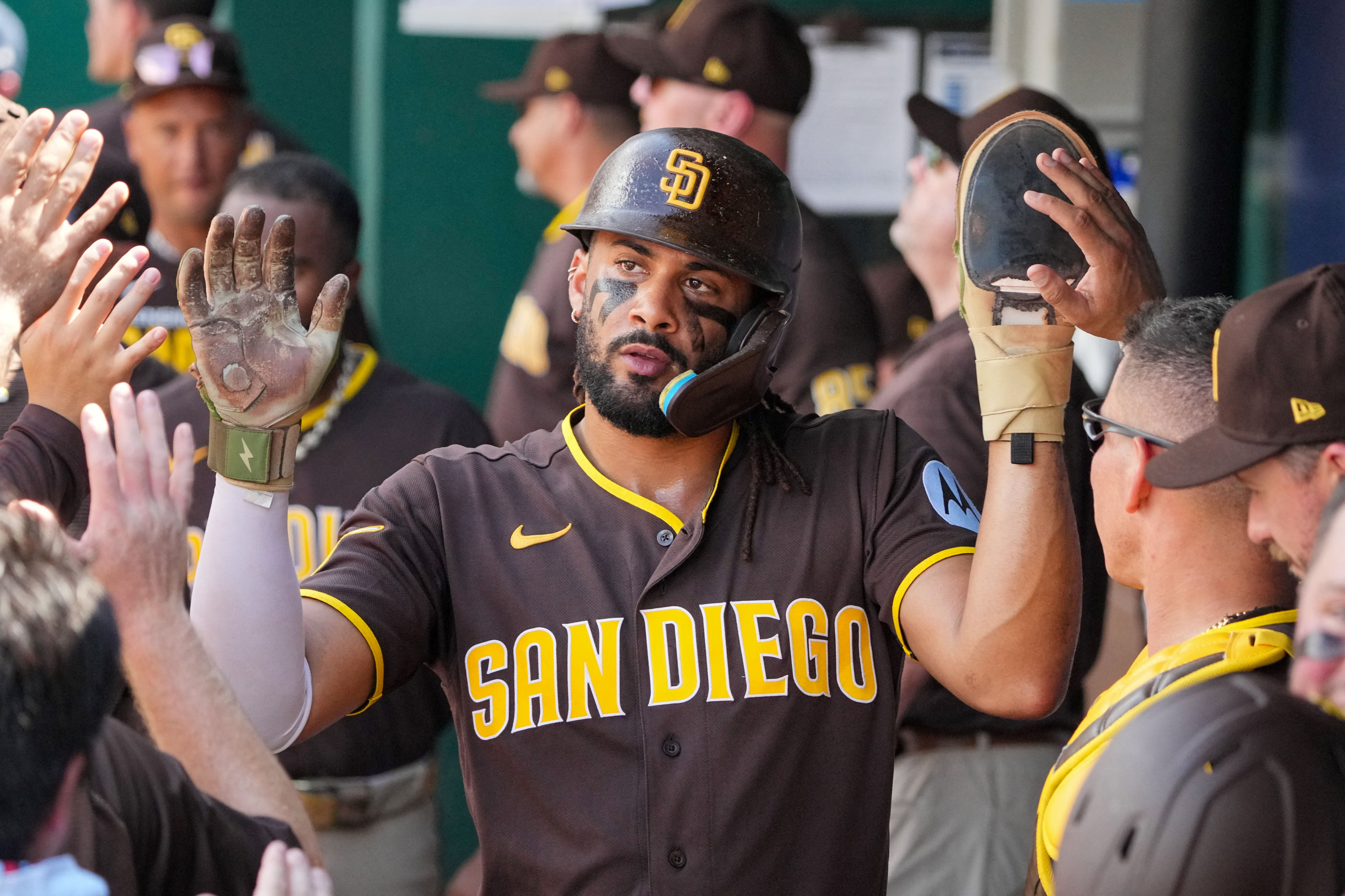 San Diego Padres right fielder Fernando Tatis Jr. celebrates in the dugout, and he's key as we look at the Padres vs. Marlins prediction.
