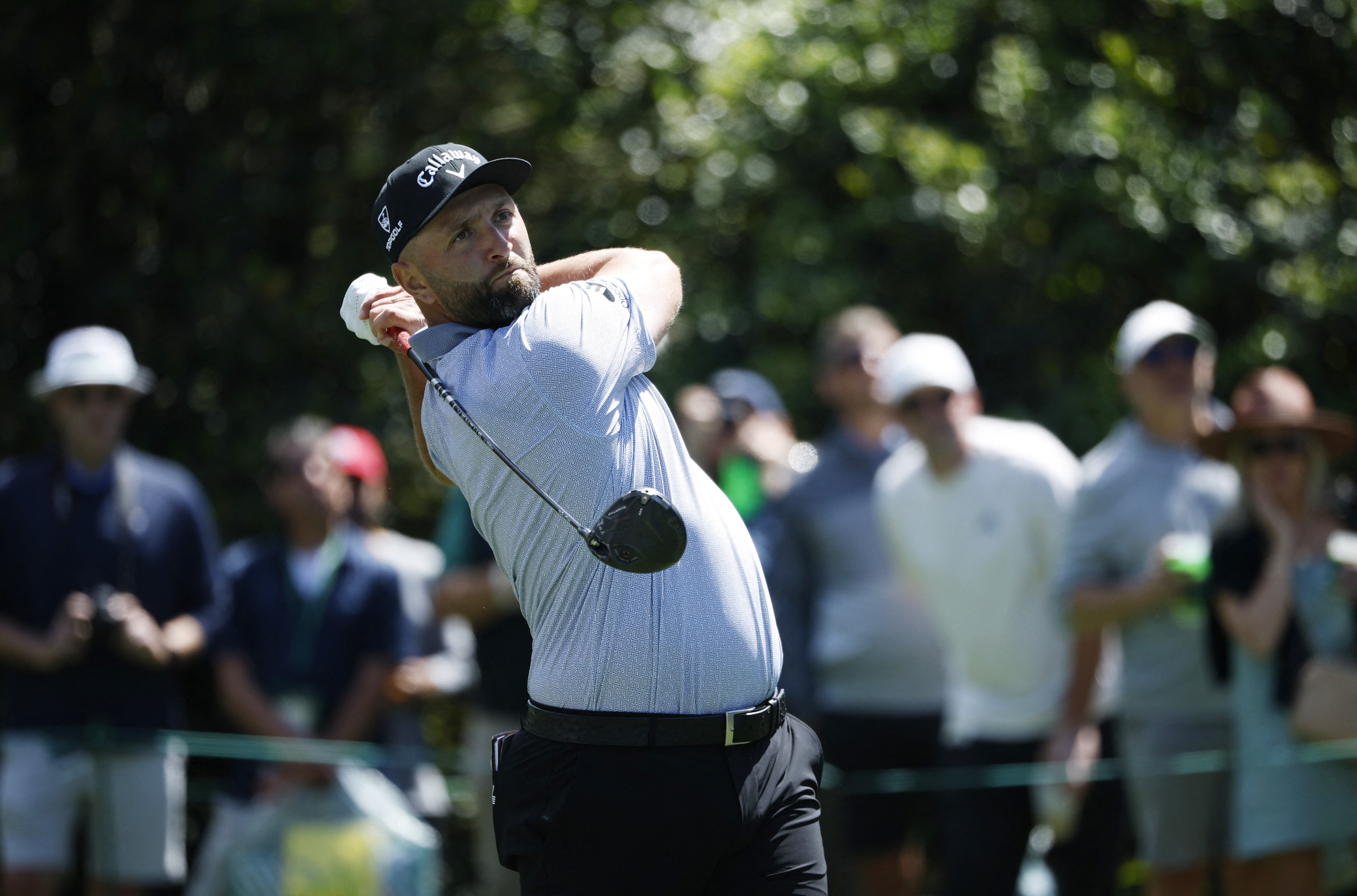 Jon Rahm hits his tee shot on the 15th hole during a practice round at Augusta National Golf Course