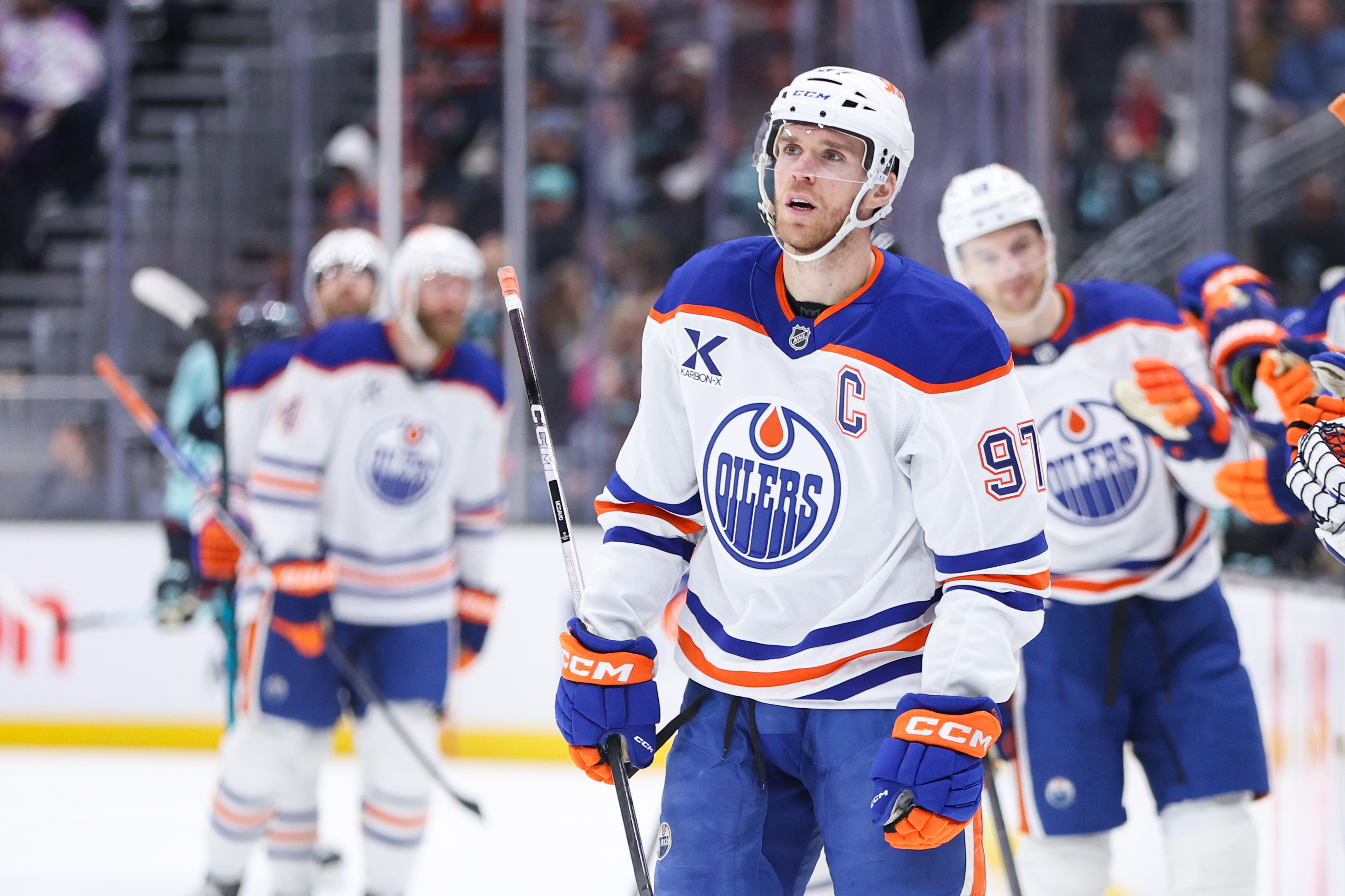 Edmonton Oilers center Connor McDavid (97), seen here celebrating a goal, is featured in our NHL player props tonight.
