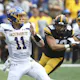 Quarterback Mark Gronowski of the South Dakota State Jackrabbits throws while under pressure from defensive lineman Ethan Hurkett of the Iowa Hawkeyes. South Dakota State is the expected favorite by the 2025 College Football FCS Championship Odds.