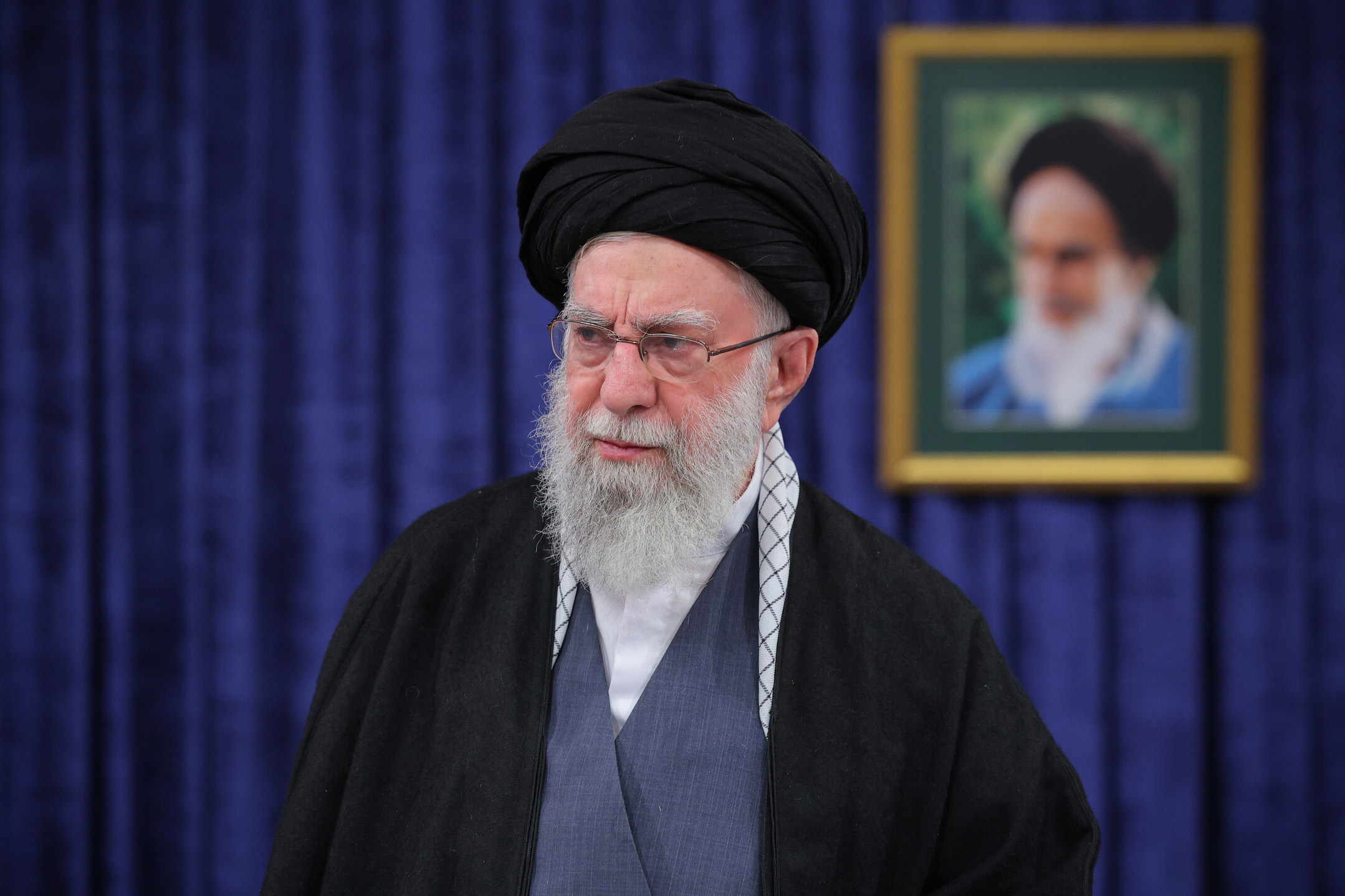 Iran’s Supreme Leader Ayatollah Ali Khamenei at an event, as we look at how Kalshi handles markets about his removal from office and death.
