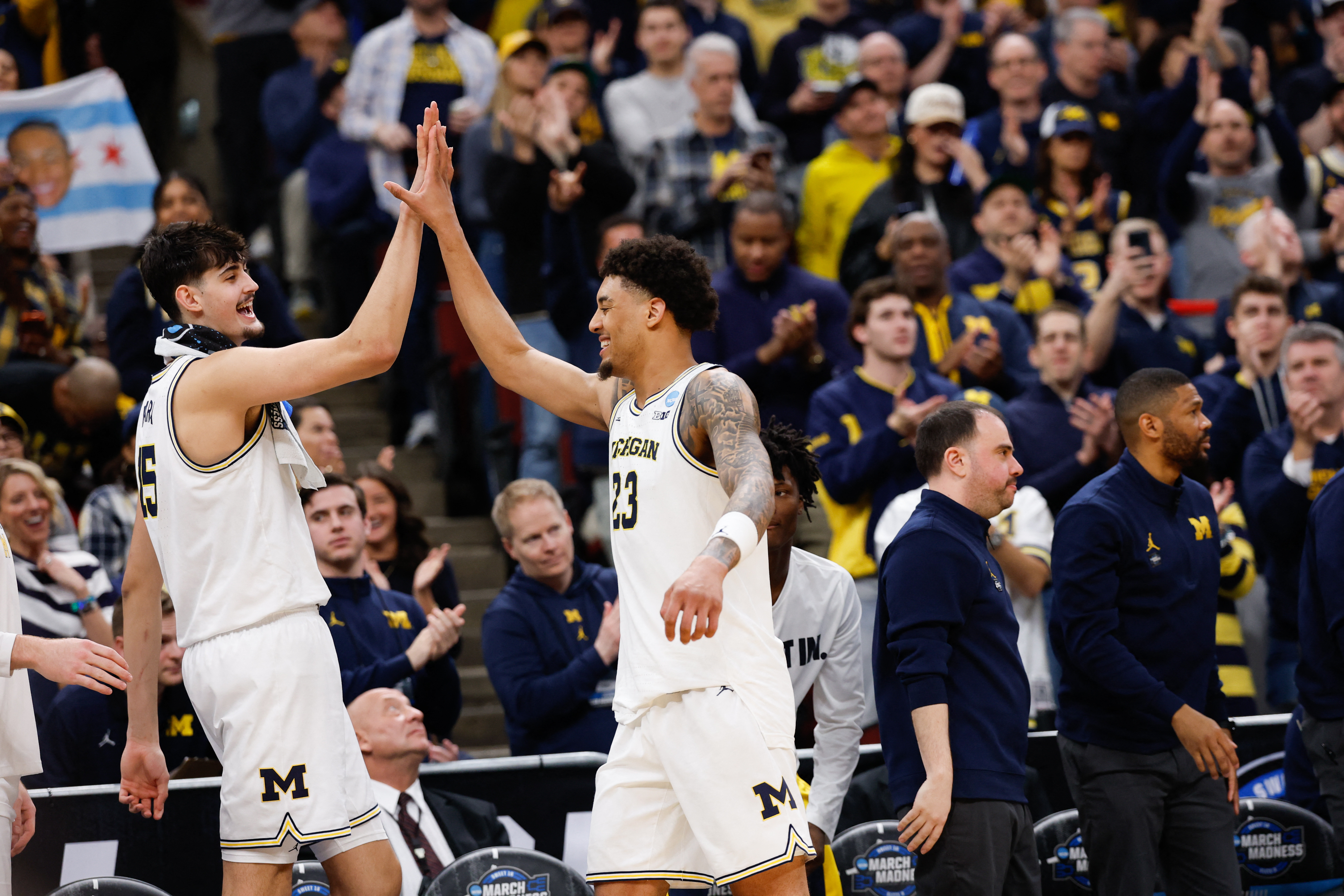 Michigan Wolverines center Aday Mara (15) high fives forward Yaxel Lendeborg (23) during the 2026 NCAA Tournament as we break down our Final Four predictions.