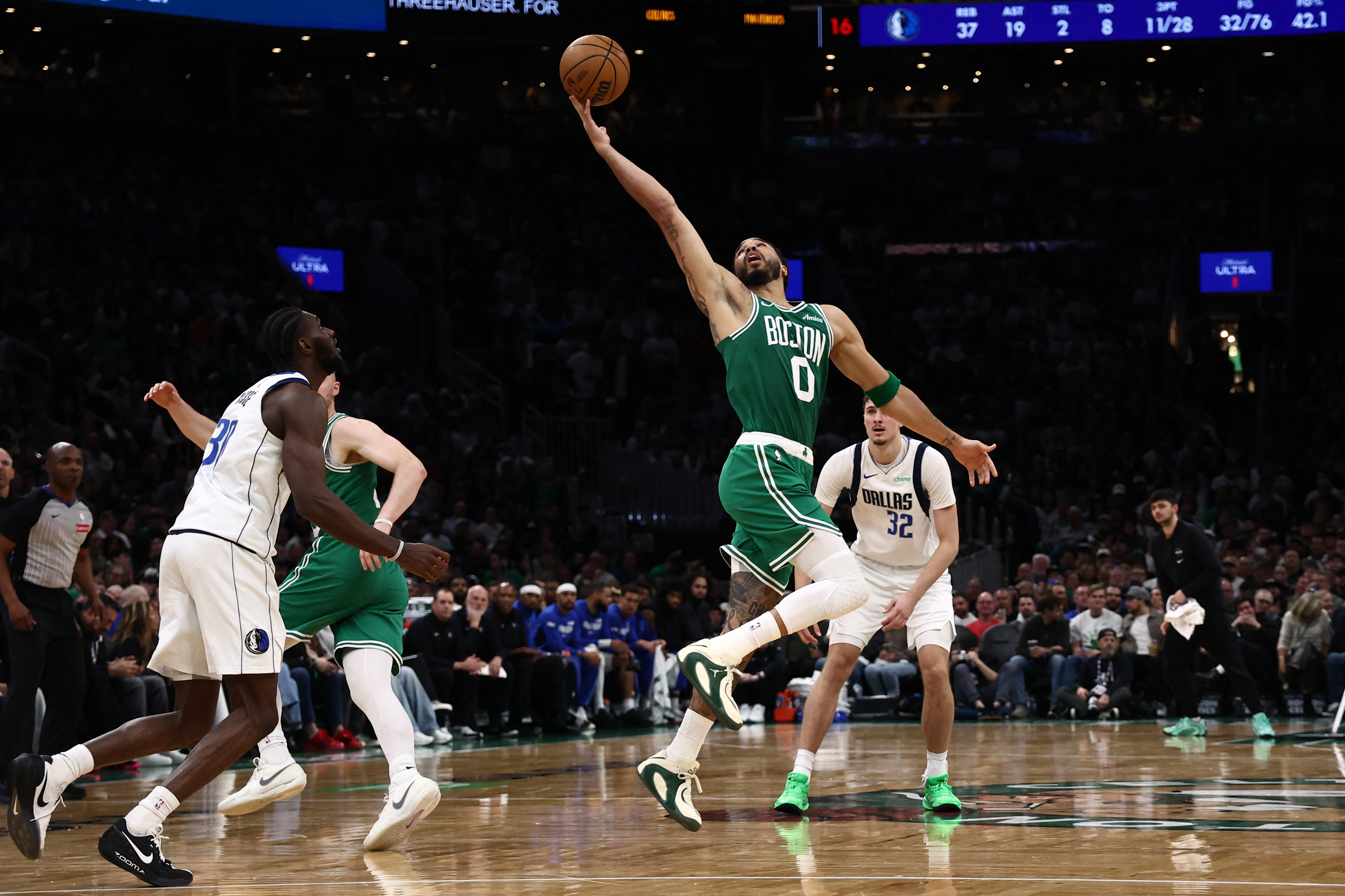 Boston Celtics forward Jayson Tatum (0) reaches for a loose ball as we look at our Celtics vs. Cavaliers player props