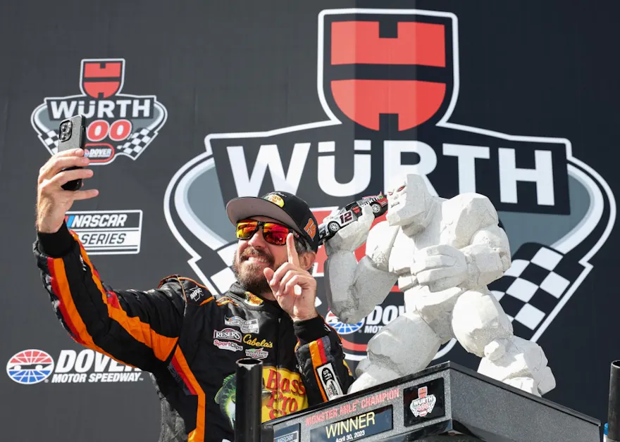 Martin Truex Jr., driver of the No. 19 Bass Pro Shops Toyota, takes a selfie with the Monster Mile trophy as we preview the Würth 400 at Dover Motor Speedway.