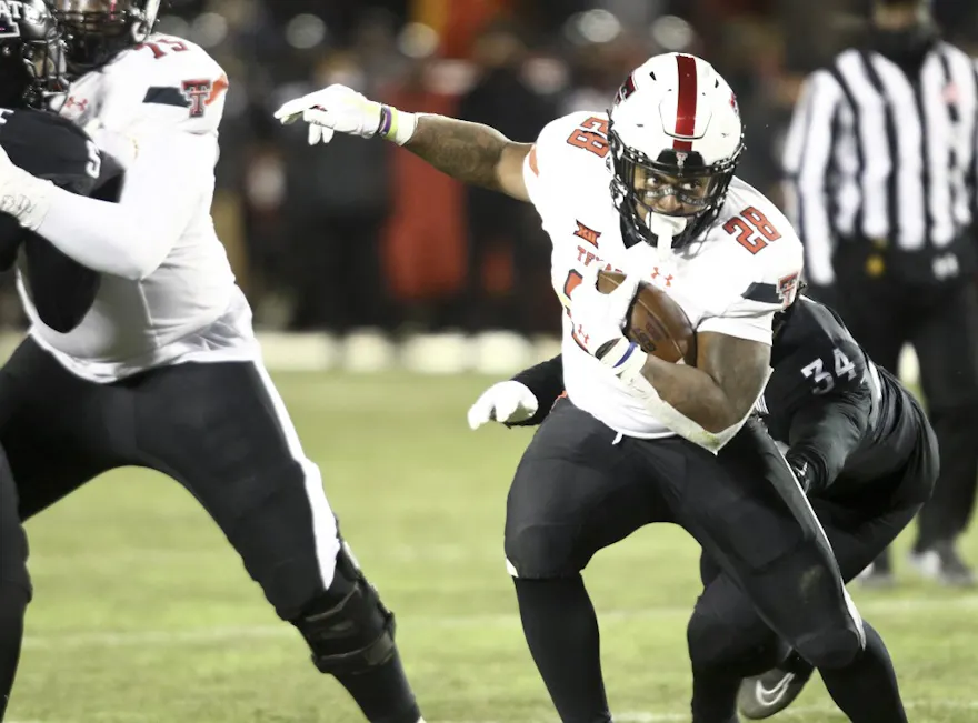 Running back Tahj Brooks of the Texas Tech Red Raiders runs up the field during the second half against the Iowa State Cyclones.
