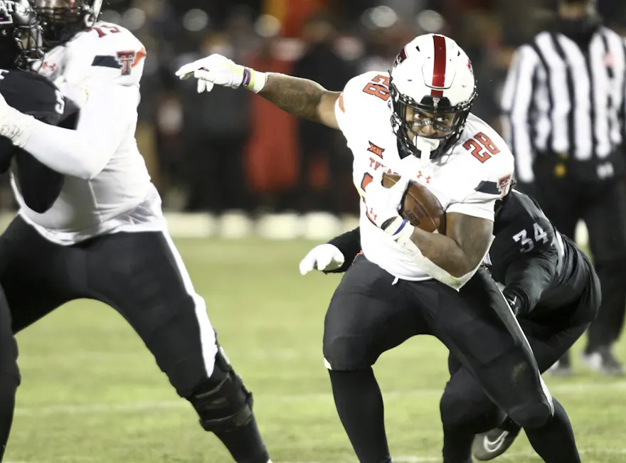 Running back Tahj Brooks of the Texas Tech Red Raiders runs up the field as we look at the best California vs. Texas Tech bonus code.