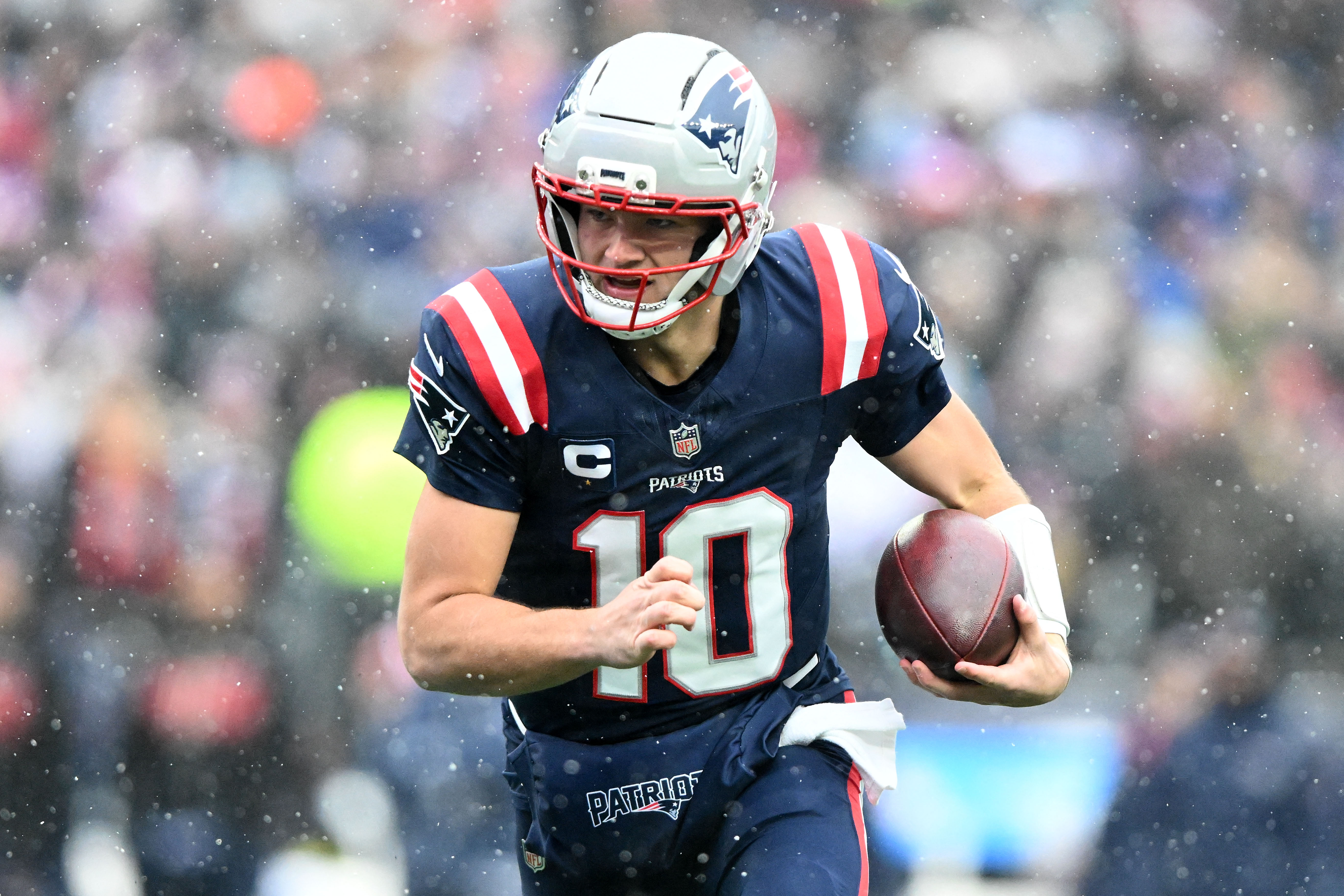 New England Patriots quarterback Drake Maye (10) runs with the ball as we look to answer, will Drake Maye score a touchdown?