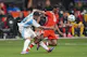 Argentina defender Cristian Romero and Canada forward Jonathan David battle for the ball during the second half as we make our picks and predictions for Canada's Copa America contest against Peru. 