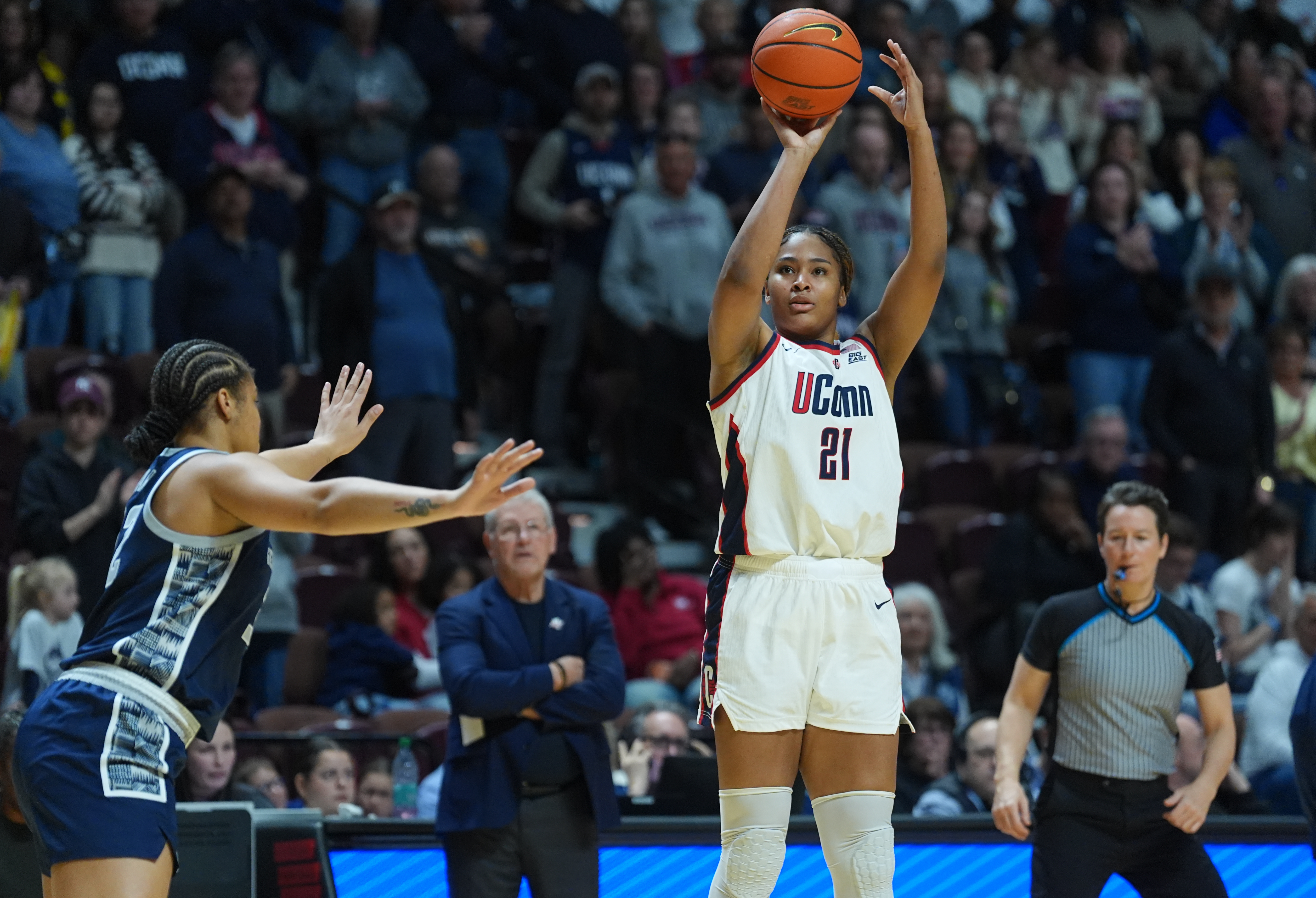 UConn Huskies forward Sarah Strong (21) shots the ball as she is featured in our UTSA vs. UConn prediction & picks.