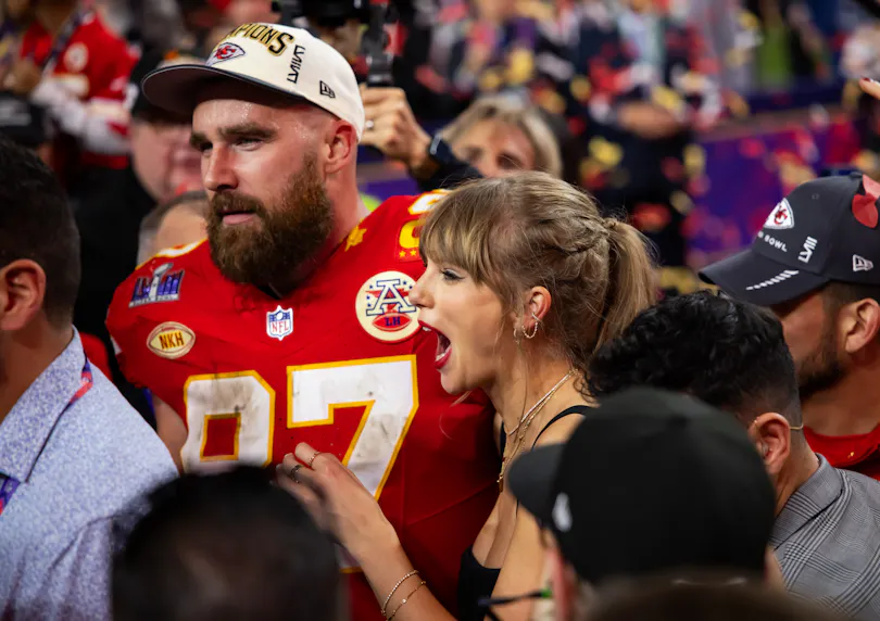 Kansas City Chiefs tight end Travis Kelce celebrates with girlfriend Taylor Swift after defeating the San Francisco 49ers in the Super Bowl, and we look at the best Travis Kelce player props based on Taylor Swift's attendance.