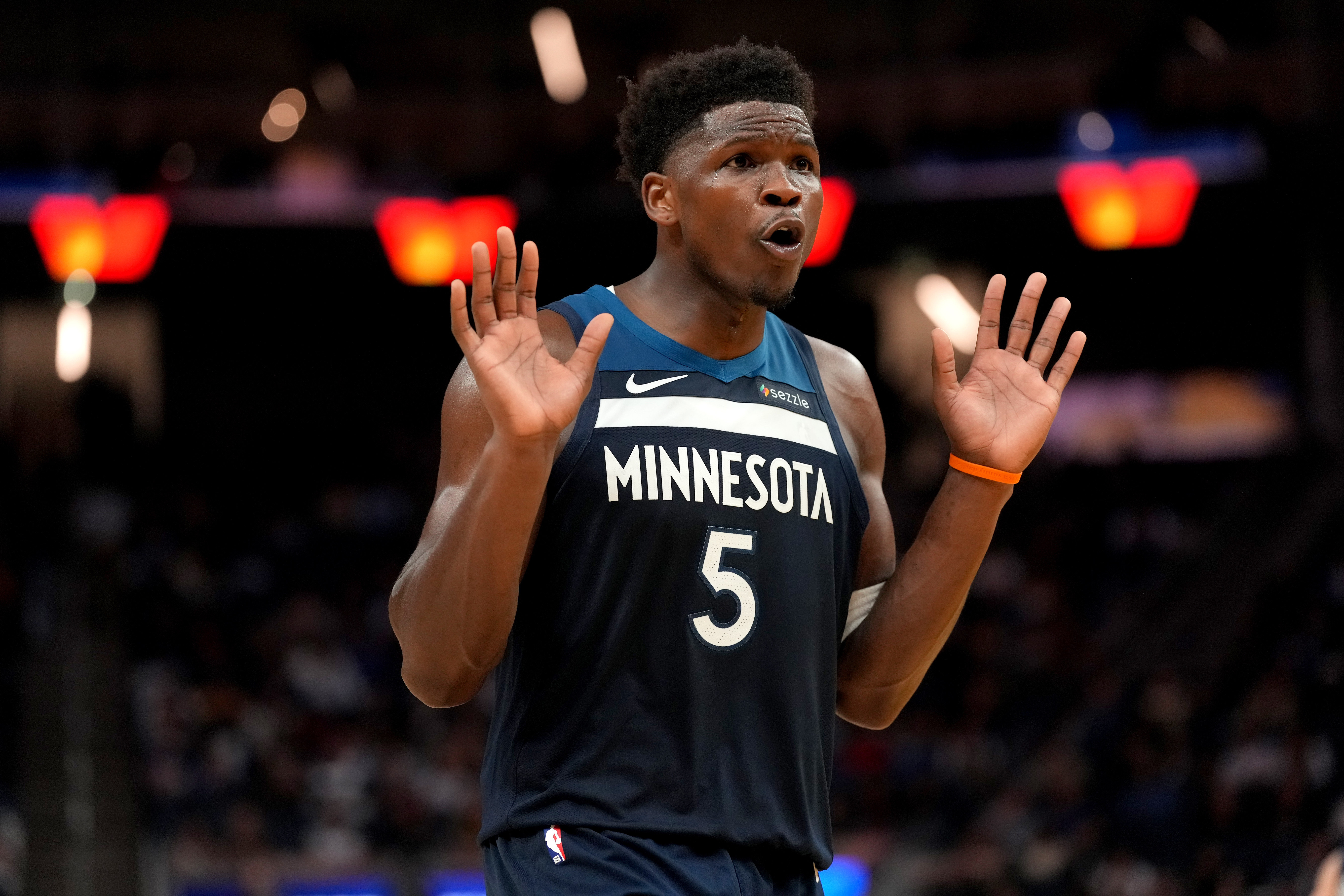 Minnesota Timberwolves guard Anthony Edwards (5), seen here reacting during a game, is featured in our NBA player props tonight.