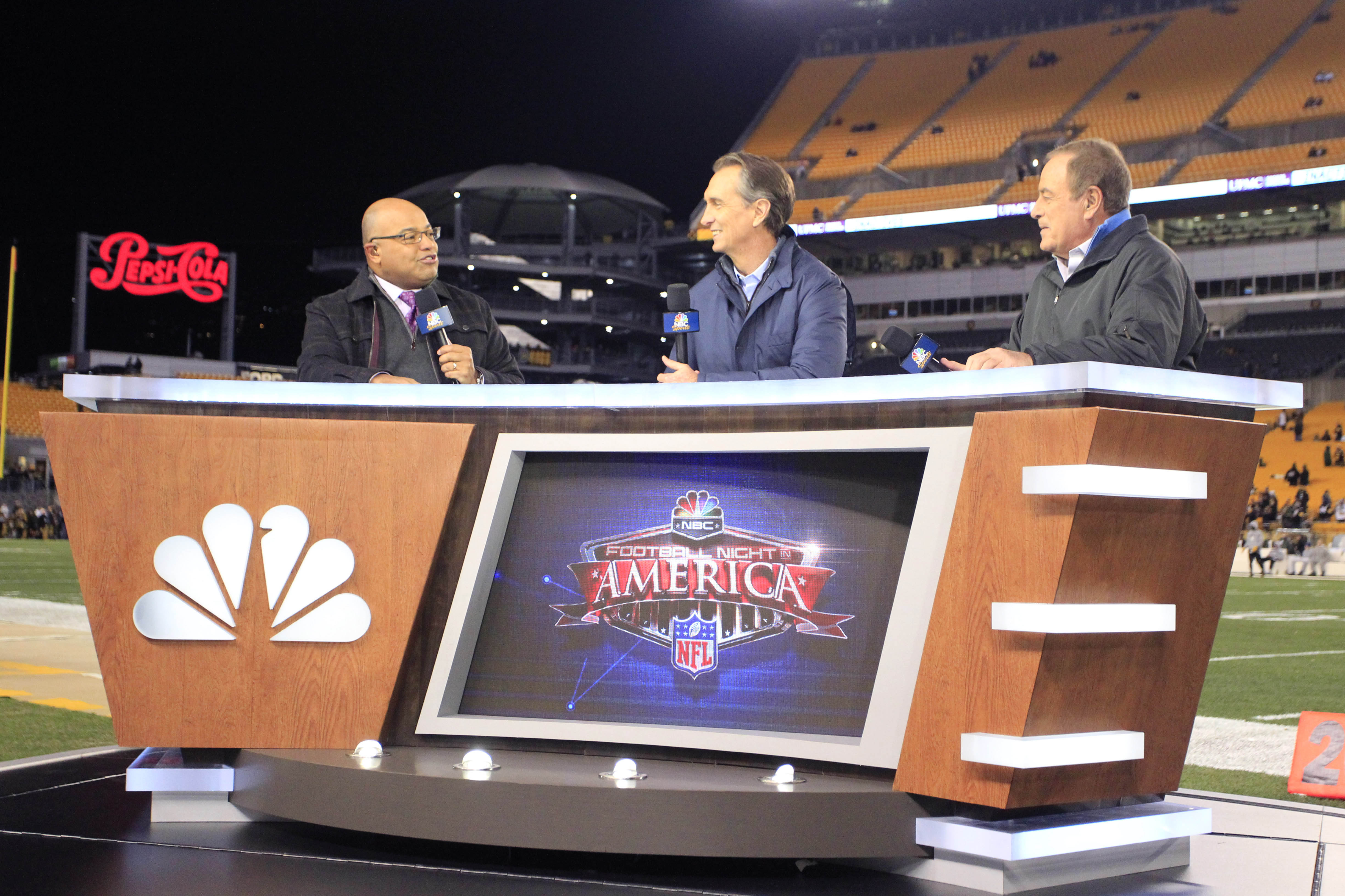 NBC Football Night in America television commentators Mike Tirico (left) and Cris Collinsworth (middle) perform a pre-game show as we look at the 2026 Super Bowl prediction mention markets