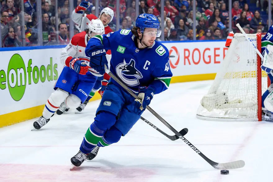 Quinn Hughes #43 of the Vancouver Canucks skates with the puck during the second period as we make our best prop picks and predictions for Game 1 of the Nashville Predators vs. Vancouver Canucks series. 