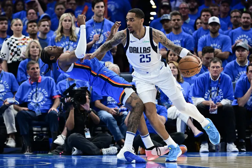 P.J. Washington (25) of the Dallas Mavericks drives to the basket against Jalen Williams (8) of the Oklahoma City Thunder, as we offer our best Thunder vs. Mavericks player props for Saturday's Game 3 at American Airlines Center in Dallas.