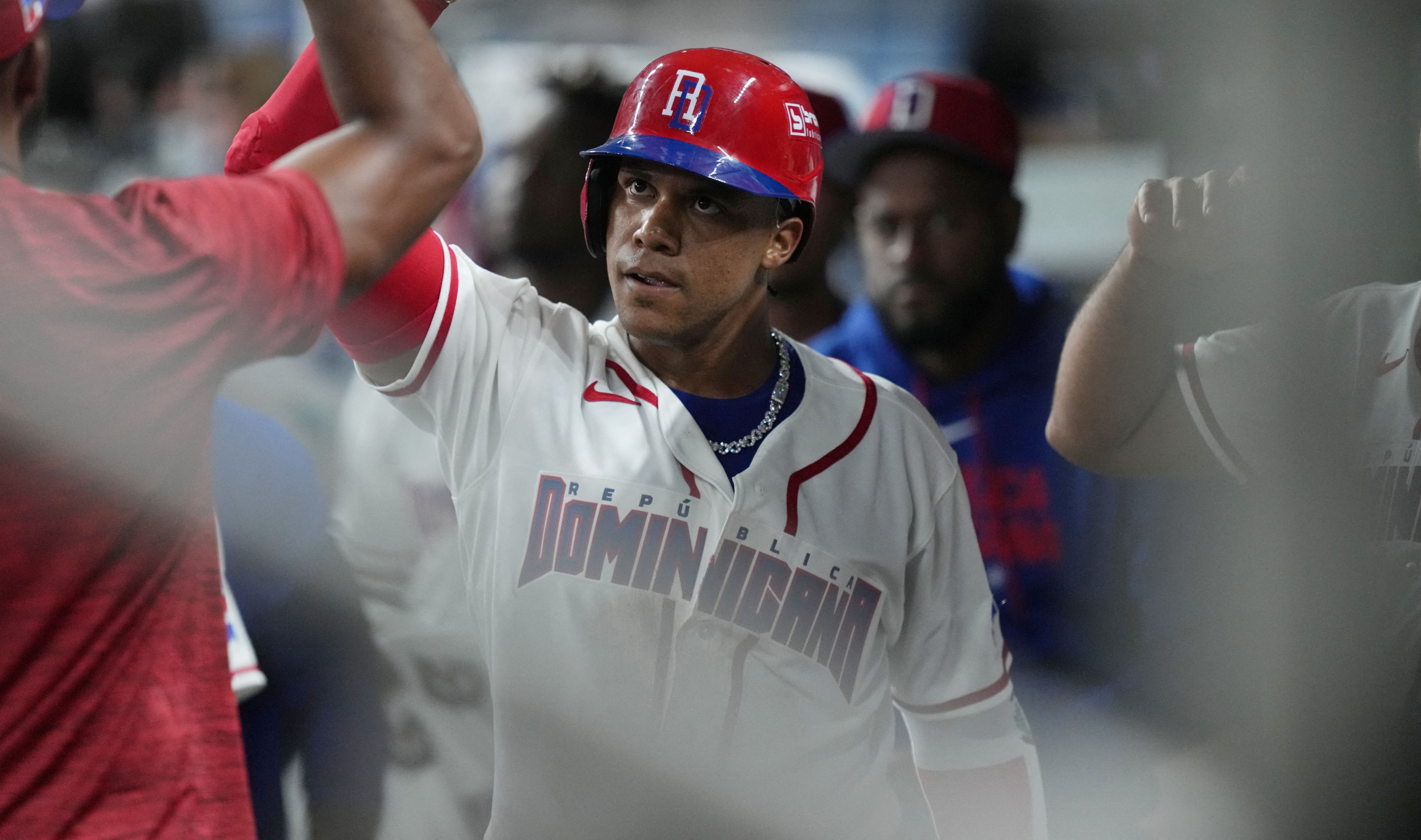 Dominican Republic right fielder Juan Soto celebrates, and he's key as we look at our Netherlands vs. Dominican Republic predictions.