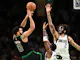 Jayson Tatum of the Boston Celtics attempts a basket against Kyrie Irving of the Dallas Mavericks and Dereck Lively II during the second quarter at the TD Garden. We're breaking down the Jayson Tatum odds ahead of Game 1 of the NBA Finals.