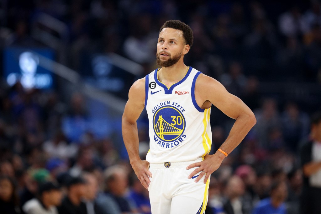 Stephen Curry of the Golden State Warriors stands on the court as we share our best Pelicans vs. Warriors player props.
