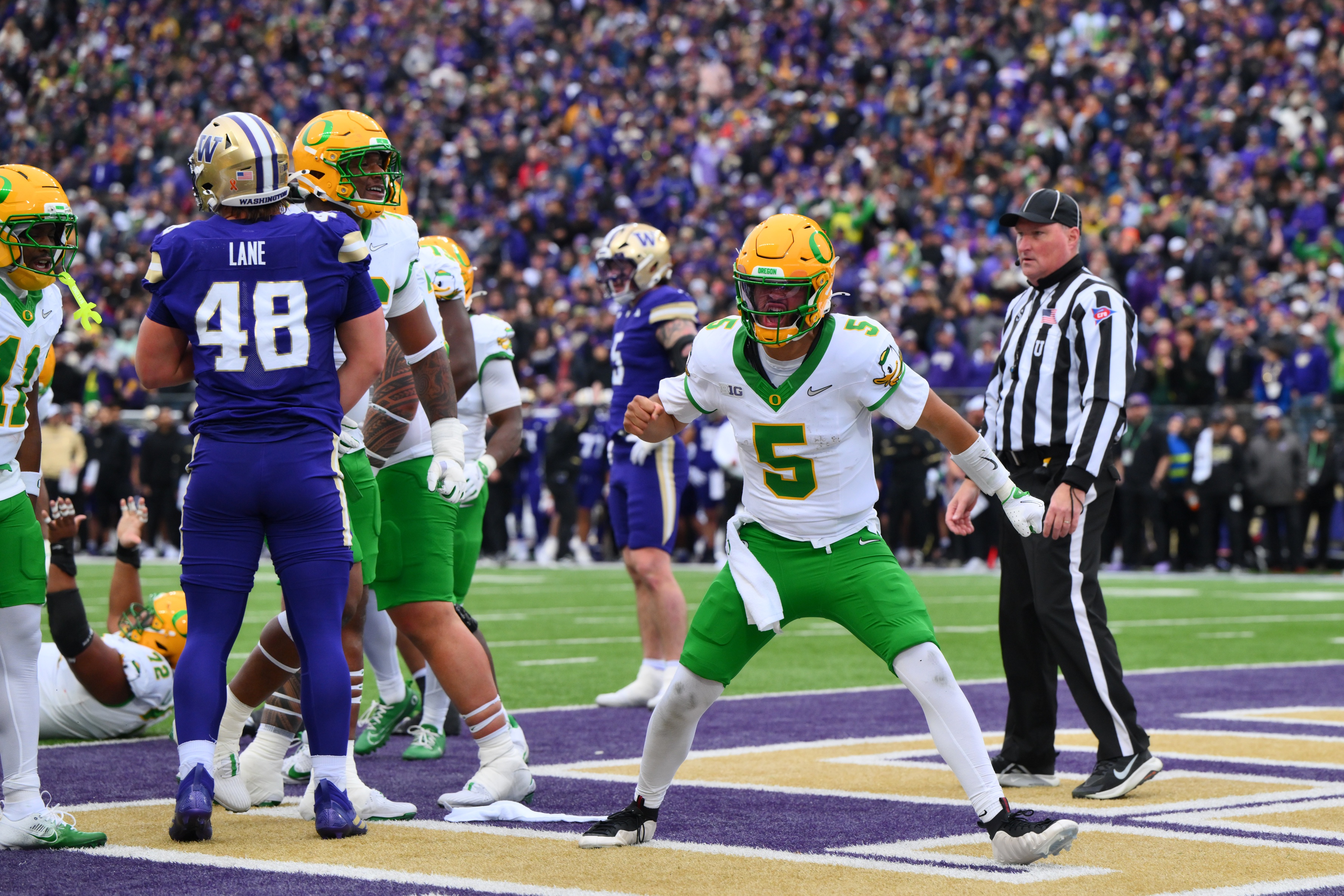 Oregon Ducks quarterback Dante Moore (5) celebrates after scoring a touchdown as part of our James Madison vs. Oregon prediction.