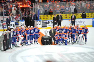 Edmonton Oilers players pose with the Western Conference trophy as we look at the best 2024 Stanley Cup odds