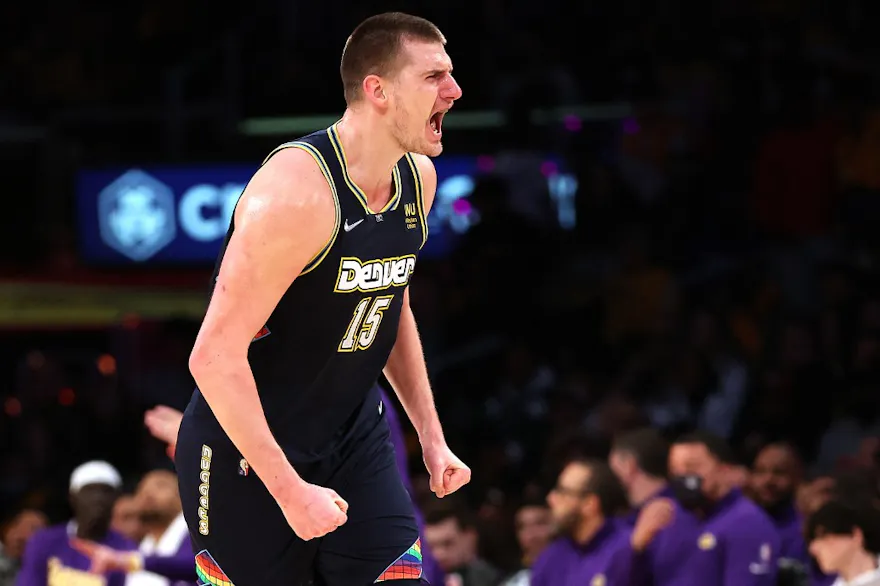 Nikola Jokic of the Denver Nuggets reacts after scoring, and we offer our top NBA player props and expert picks for Saturday based on the best NBA odds.