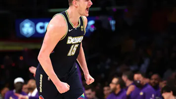 Nikola Jokic of the Denver Nuggets reacts after scoring and we offer our top odds and SGP picks for Monday's NBA games.