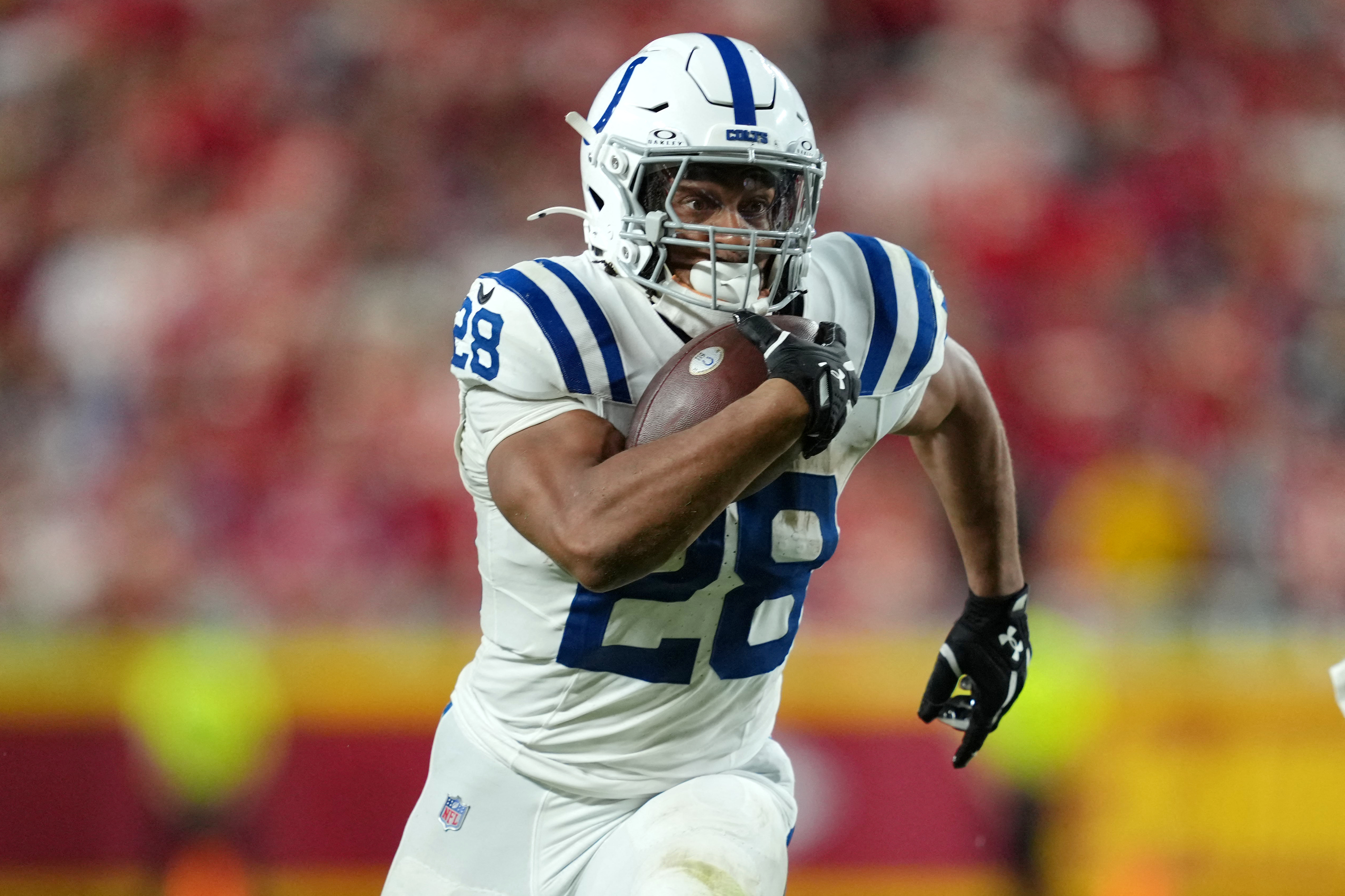 Indianapolis Colts running back Jonathan Taylor (28) carries the ball as we provide our Texans vs. Colts prediction.