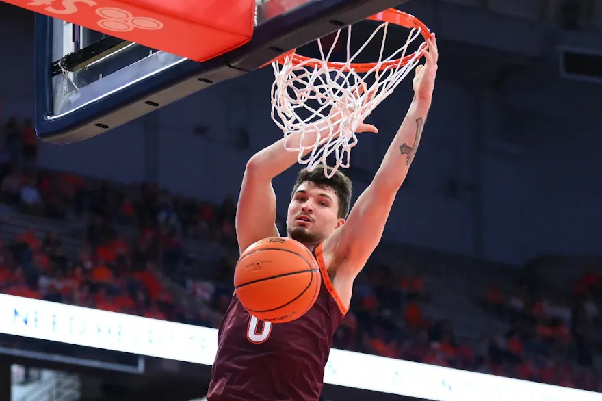 Hunter Cattoor #0 of the Virginia Tech Hokies dunks the ball against the Syracuse Orange as we look at our Florida State vs. Virginia Tech prediction.