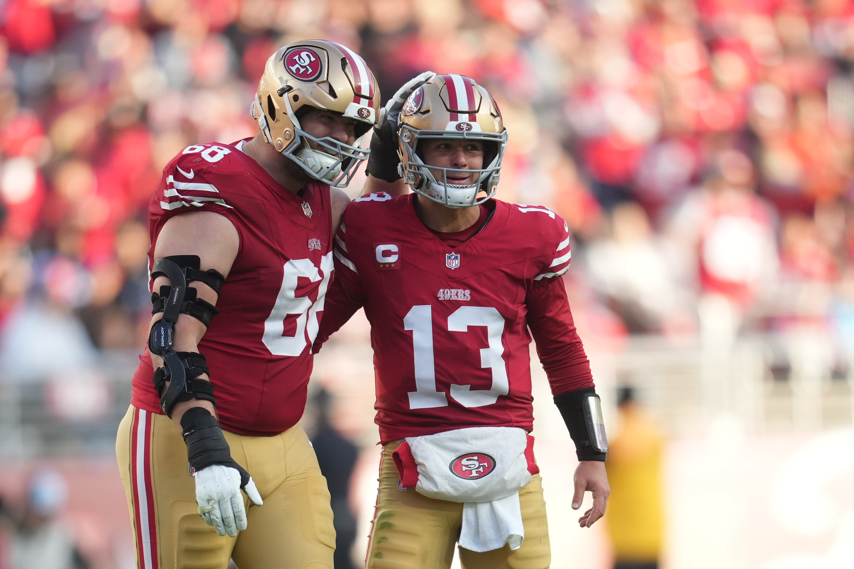 San Francisco 49ers quarterback Brock Purdy (13) reacts with offensive tackle Colton McKivitz (68) during the third quarter against the Tennessee Titans at Levi's Stadium.