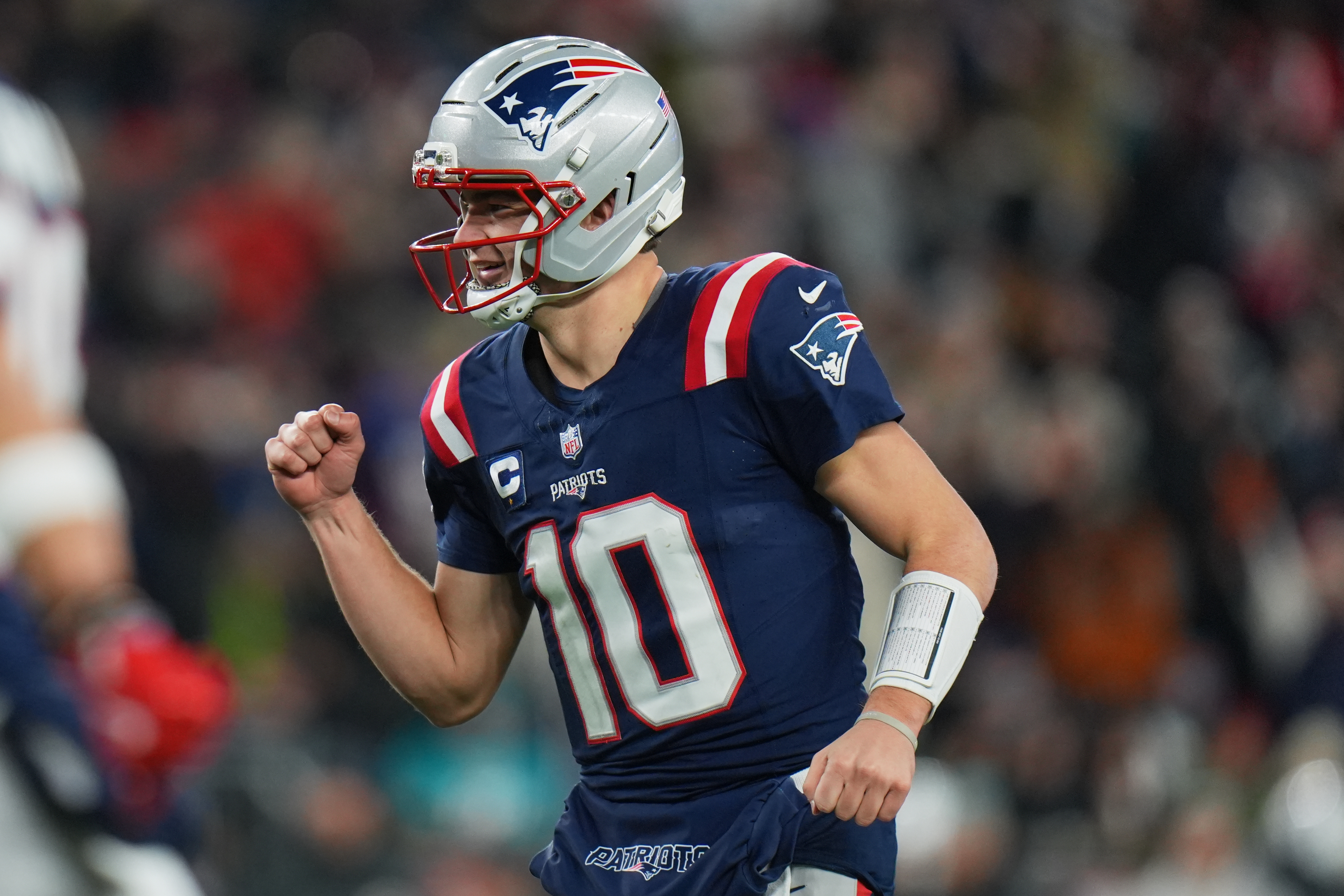 New England Patriots quarterback Drake Maye (10) reacts as we offer our Patriots vs. Chargers predictions.