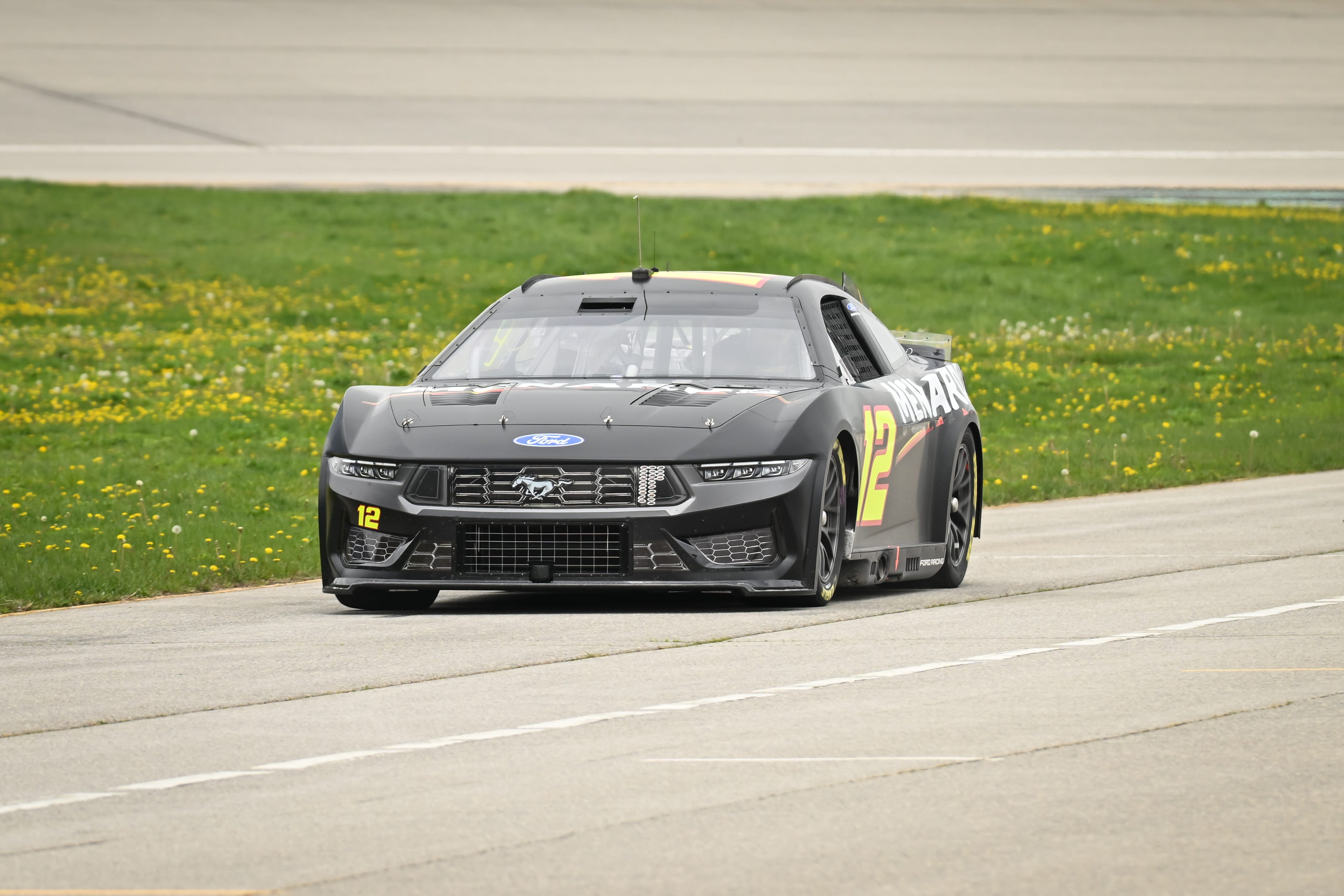 Ryan Blaney drives down pit road toward the garage during a tire test. Photo by Dave Kallmann / Milwaukee Journal Sentinel