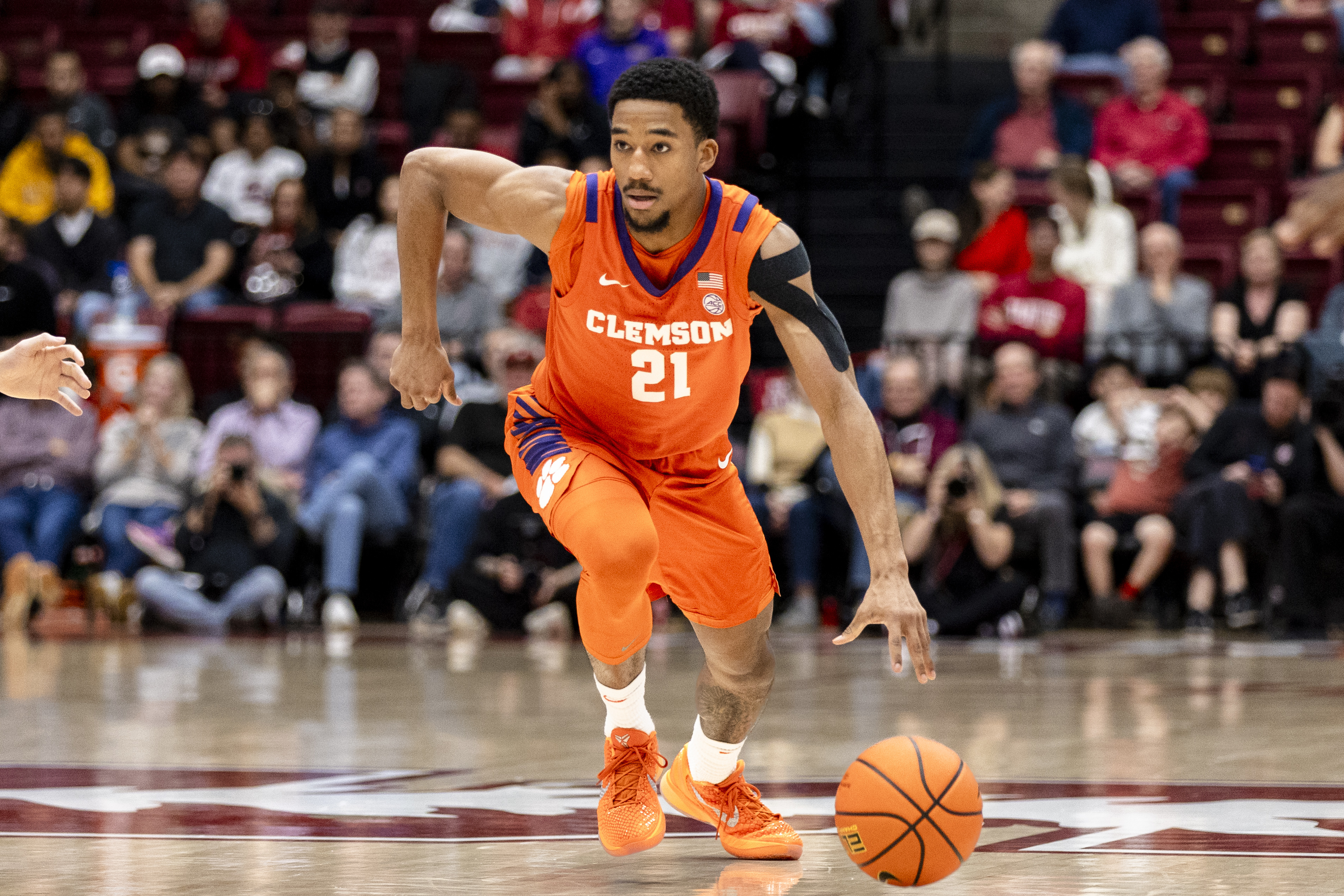 Clemson Tigers guard Ace Buckner (21), featured in our Iowa vs. Clemson prediction, dribbles against Stanford.