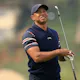 Tiger Woods of the United States plays a shot on the first hole as we look at Tiger Woods' Masters odds