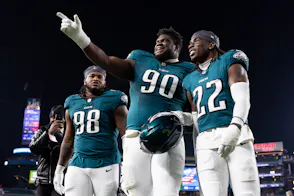 Philadelphia Eagles defensive tackle Jalen Carter, defensive tackle Jordan Davis, and cornerback Kelee Ringo walk off the field as we look at Pennsylvania sports betting financials for November 2024.